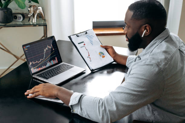 istockphoto-1429168394-612x612 Successful crypto trader investor broker, using laptop for cryptocurrency financial market analysis, buying or selling cryptocurrency, analyzing financial diagrams on the screen